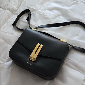 DeMellier Elegant Black Crossbody with Gold Accents